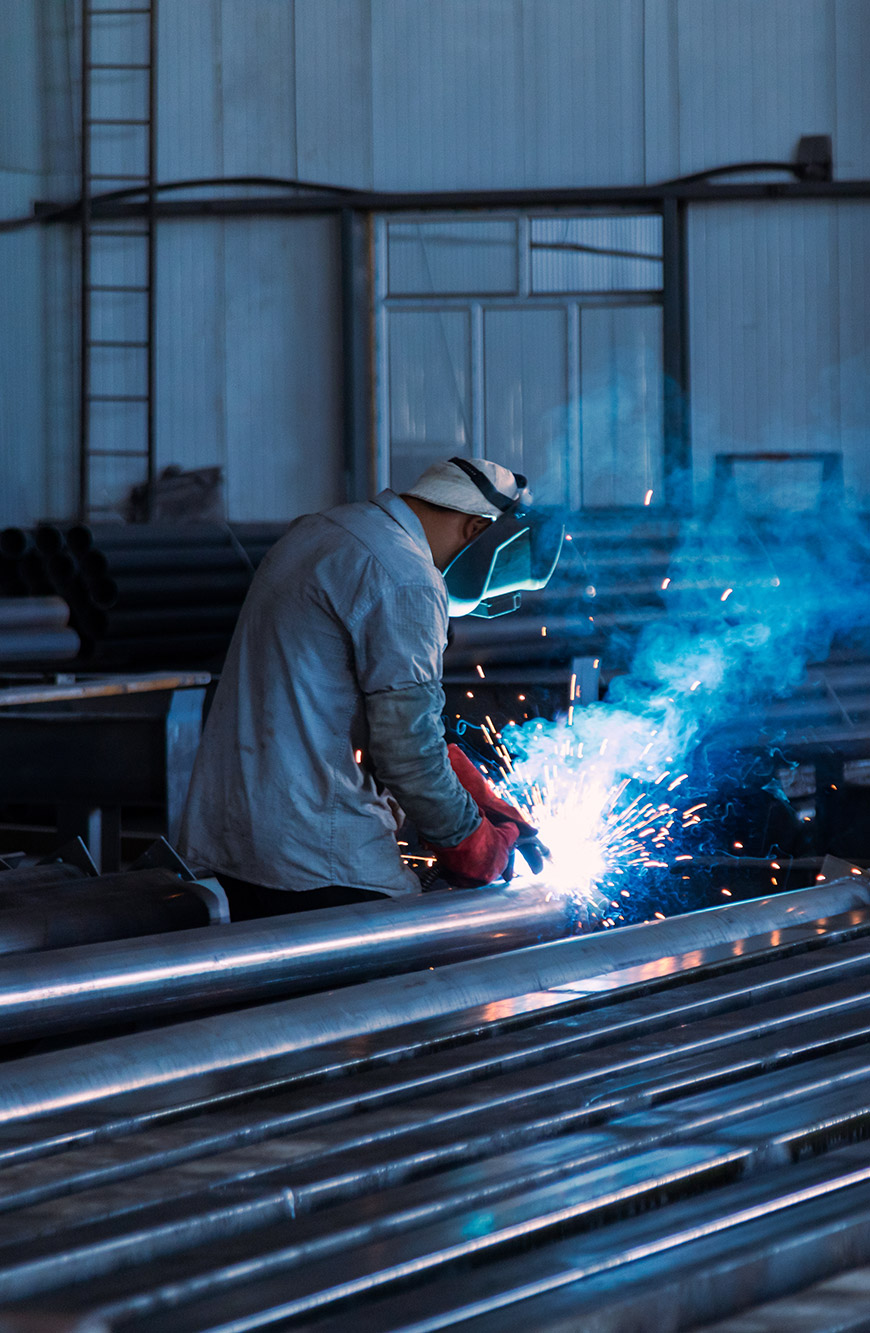 Welder manufacturing a steel stillage
